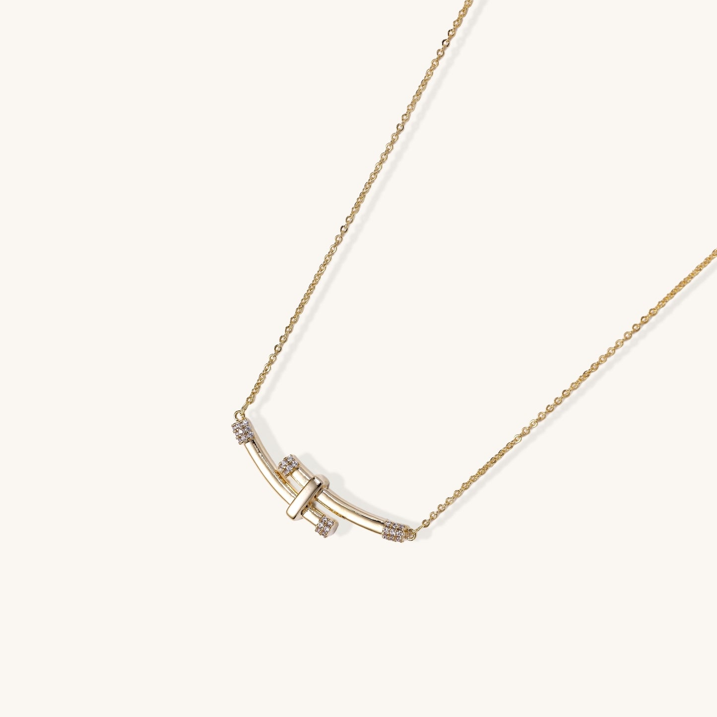 Elegant 14K gold plated necklace featuring two curved bars with diamond accents on adjustable chain
