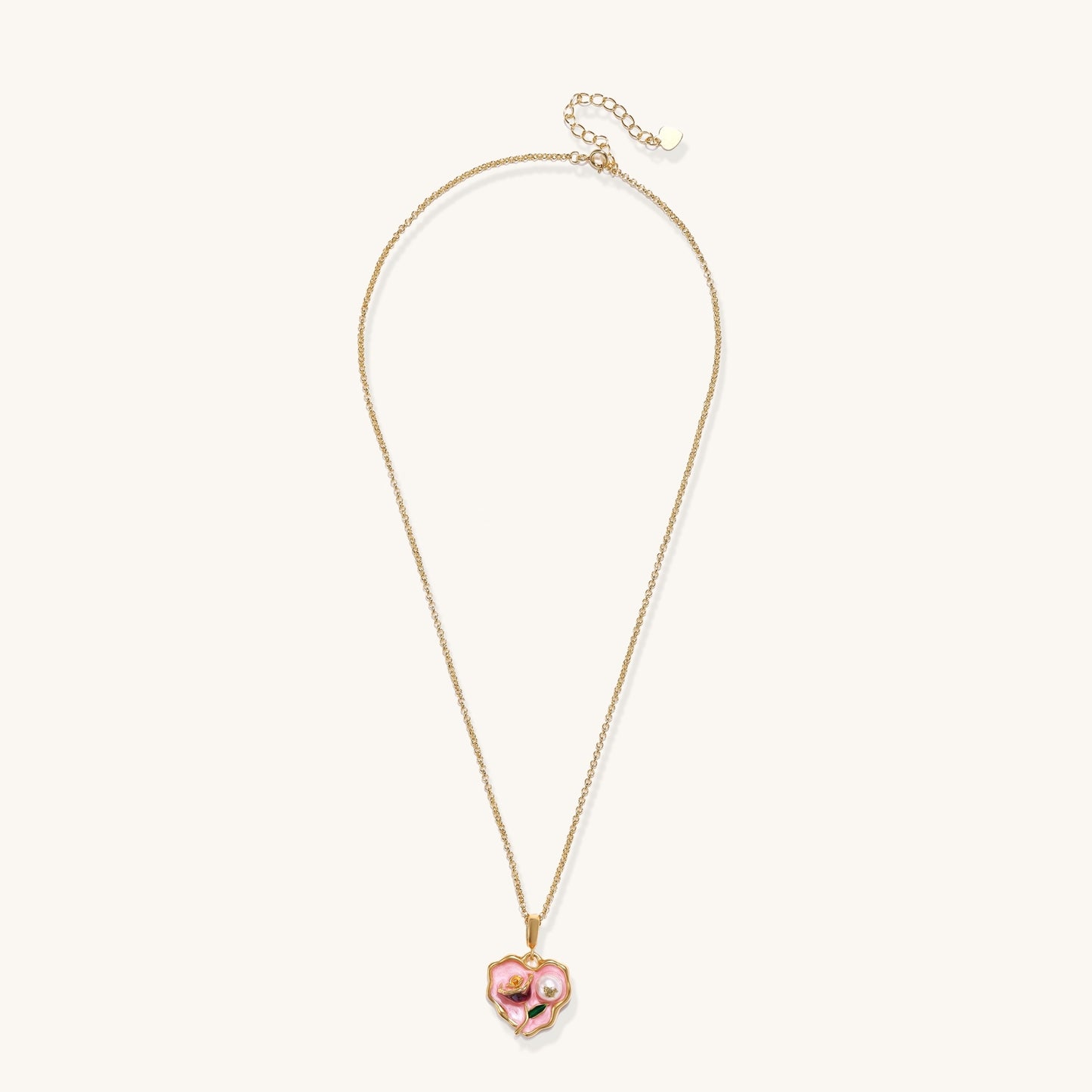 Gold-plated heart pendant necklace with pink enamel rose design and freshwater pearl on adjustable chain