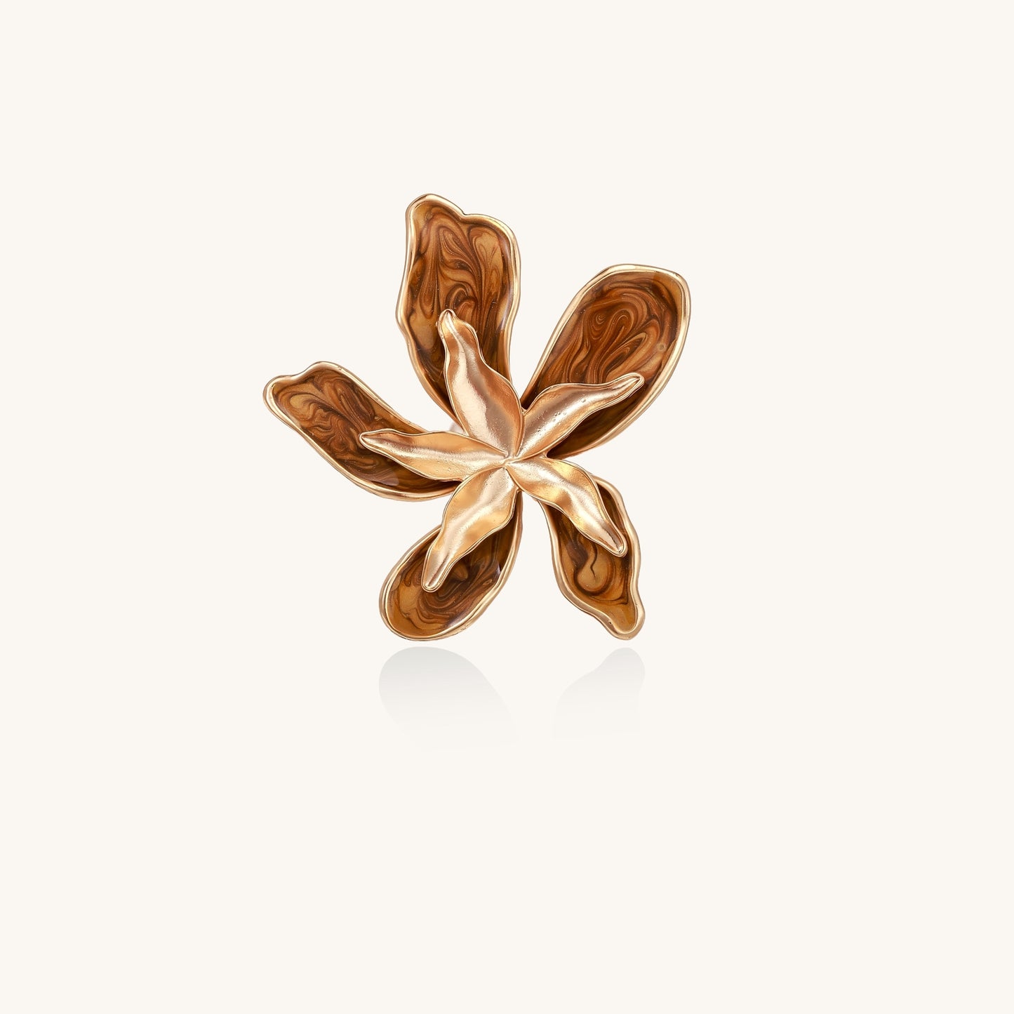 Gold-plated brass ring with 5 curved petals forming a dimensional flower design on white background.