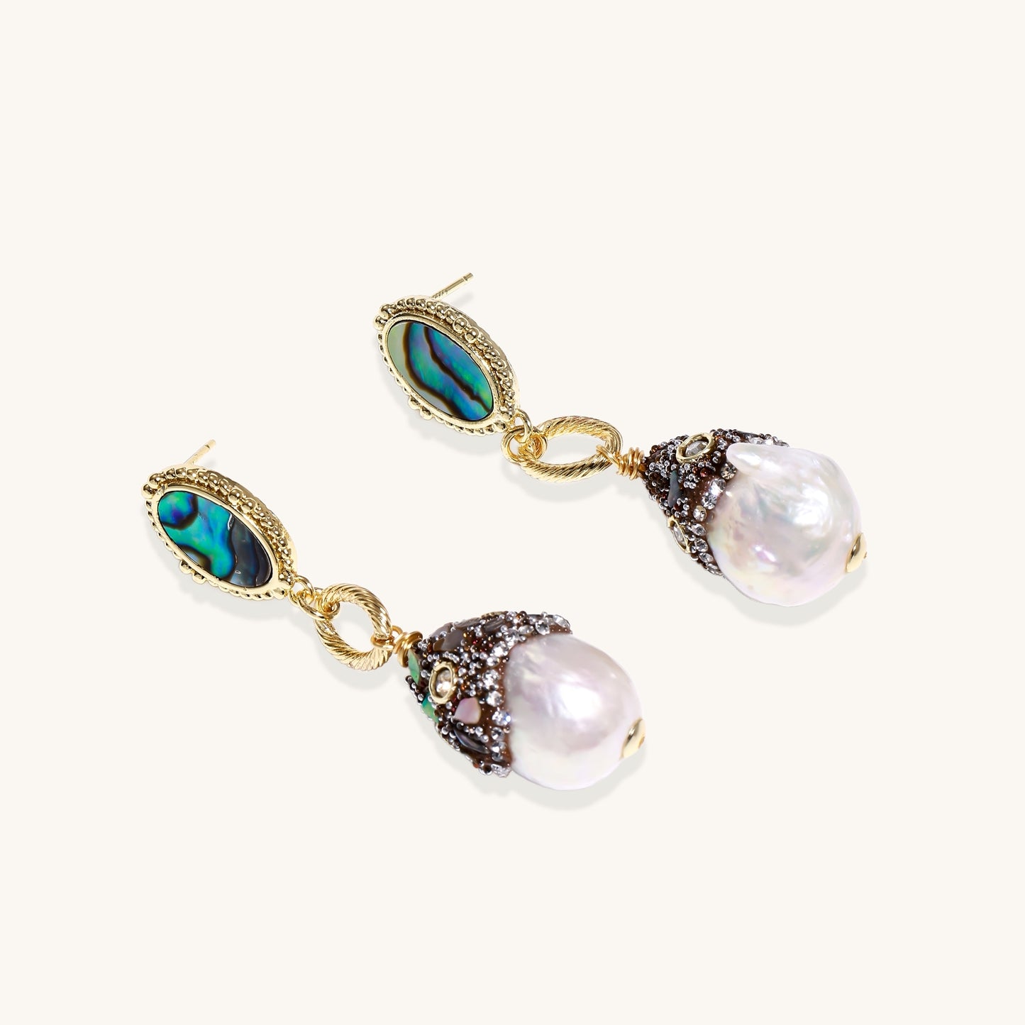 Gold-plated statement earrings with iridescent abalone shells, rope chain links, and crystal-capped baroque pearls