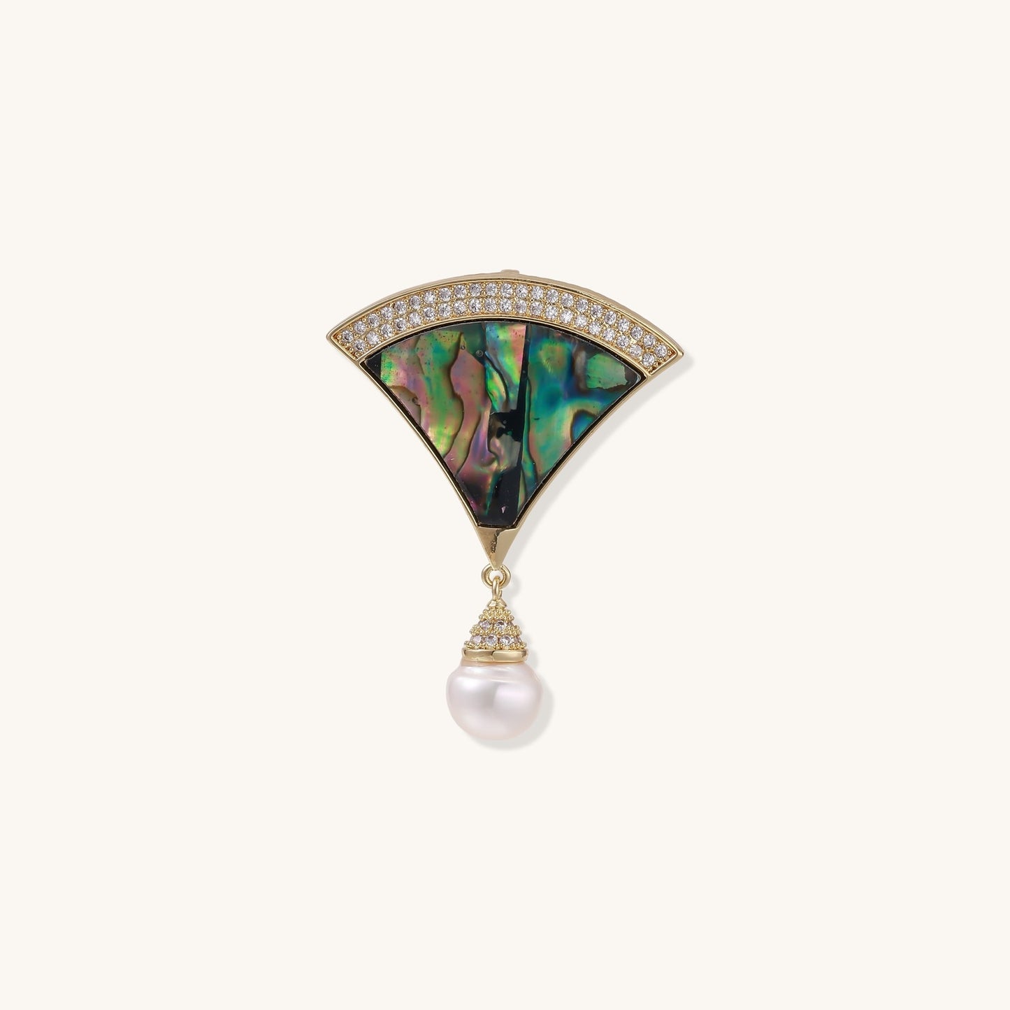 Art Deco fan-shaped pin with iridescent abalone shell, gold setting with crystals, and freshwater pearl drop.