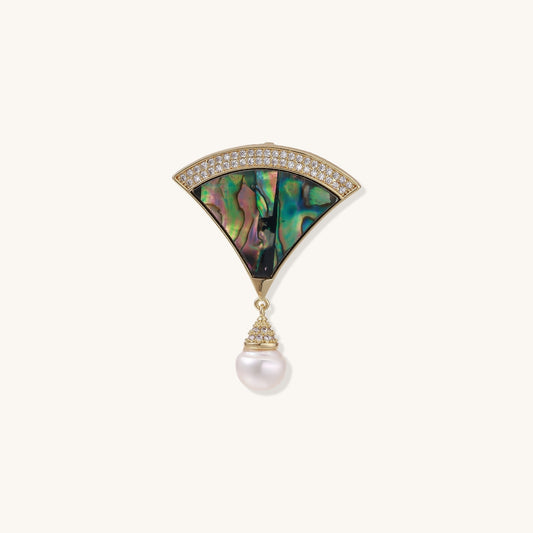 Art Deco fan-shaped pin with iridescent abalone shell, gold setting with crystals, and freshwater pearl drop.
