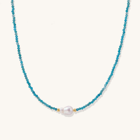 Delicate necklace featuring small turquoise apatite beads with a central freshwater pearl on sterling silver chain