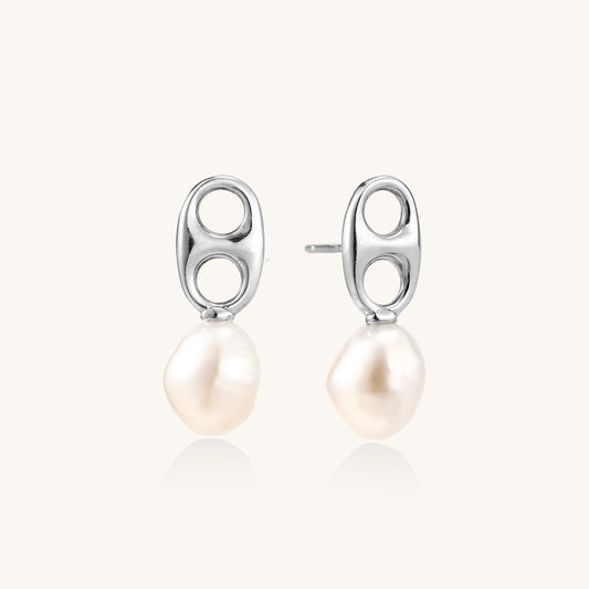 Sterling silver oval stud earrings with dual circular cutouts and suspended freshwater pearls on white background.
