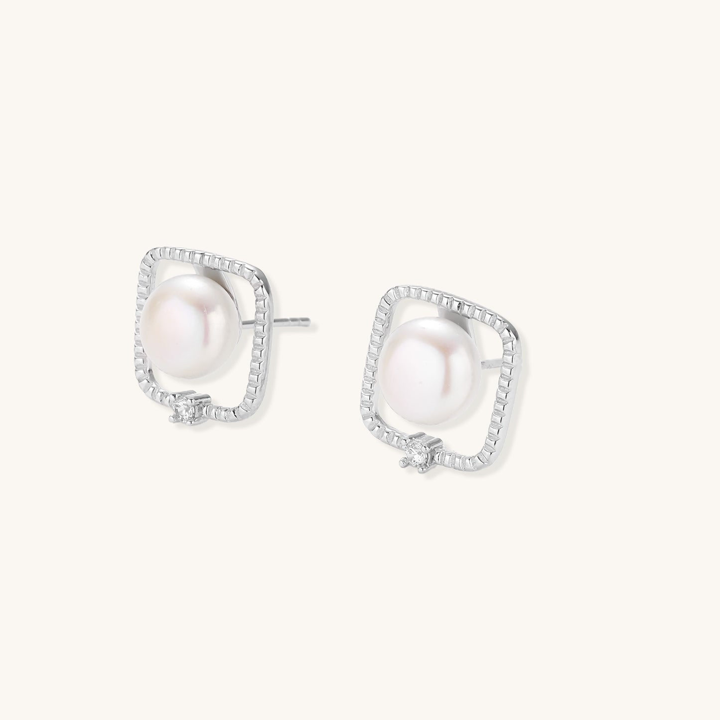 Square sterling silver stud earrings with freshwater pearls and crystal accents on white background.