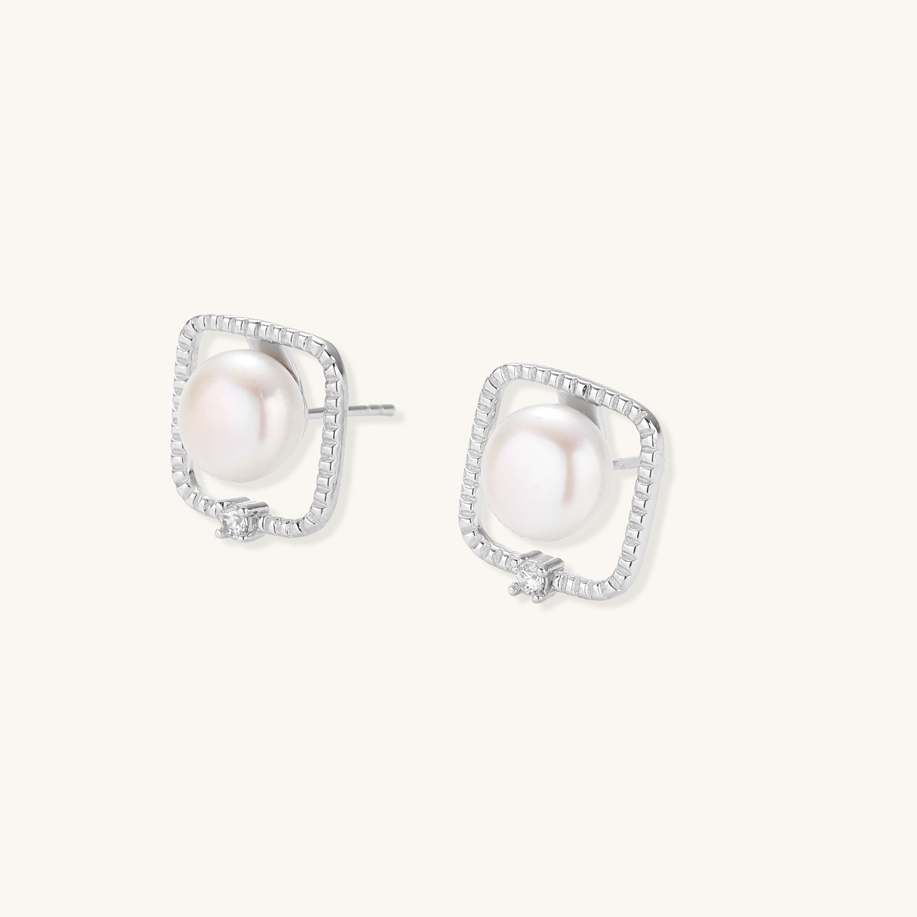 Square sterling silver stud earrings with freshwater pearls and crystal accents on white background.