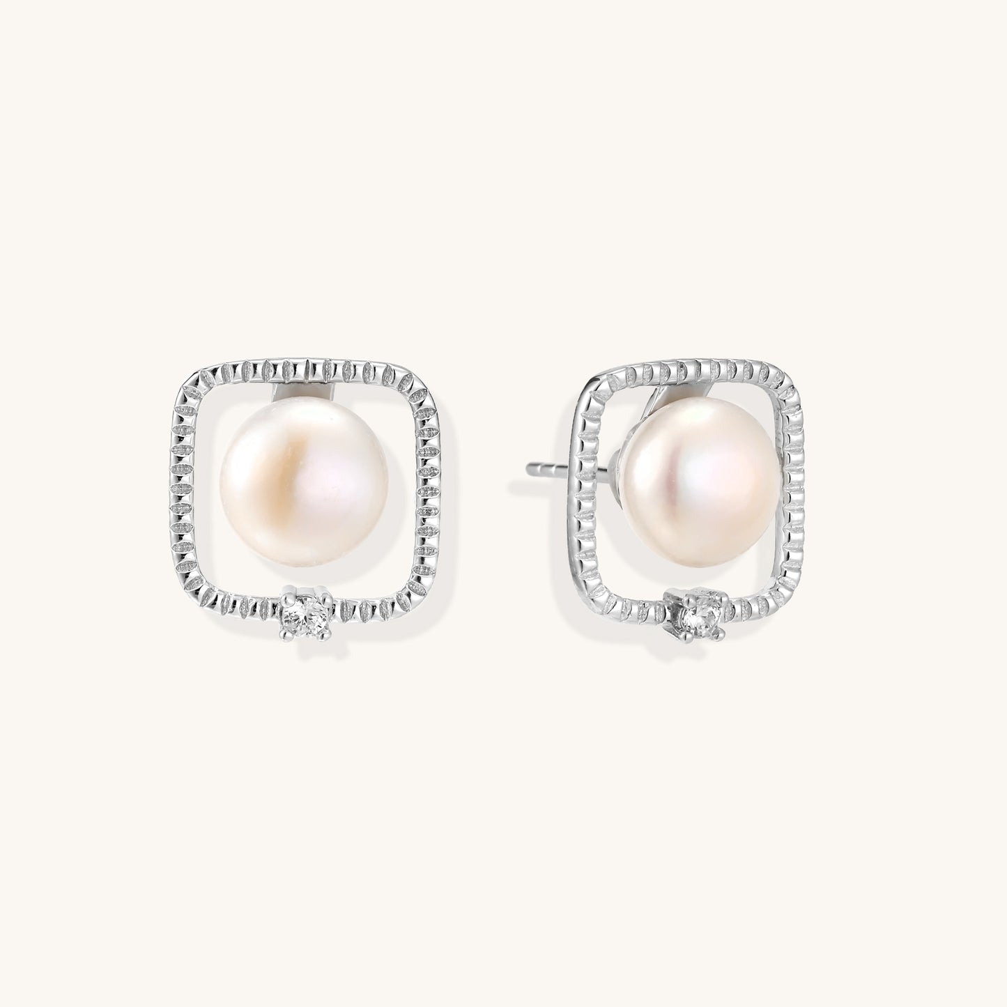 Square sterling silver stud earrings with freshwater pearls and crystal accents on white background.