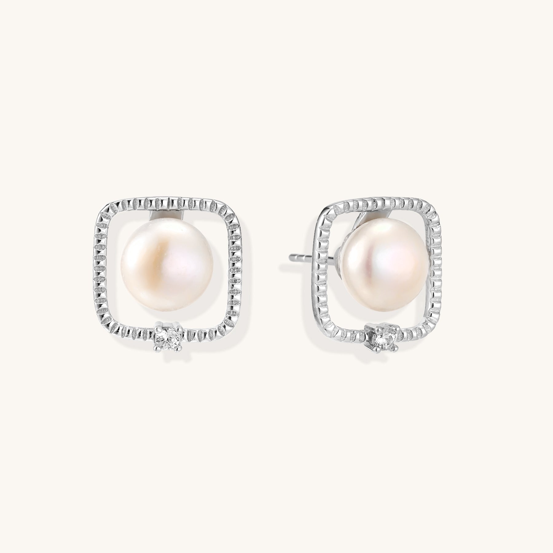 Square sterling silver stud earrings with freshwater pearls and crystal accents on white background.