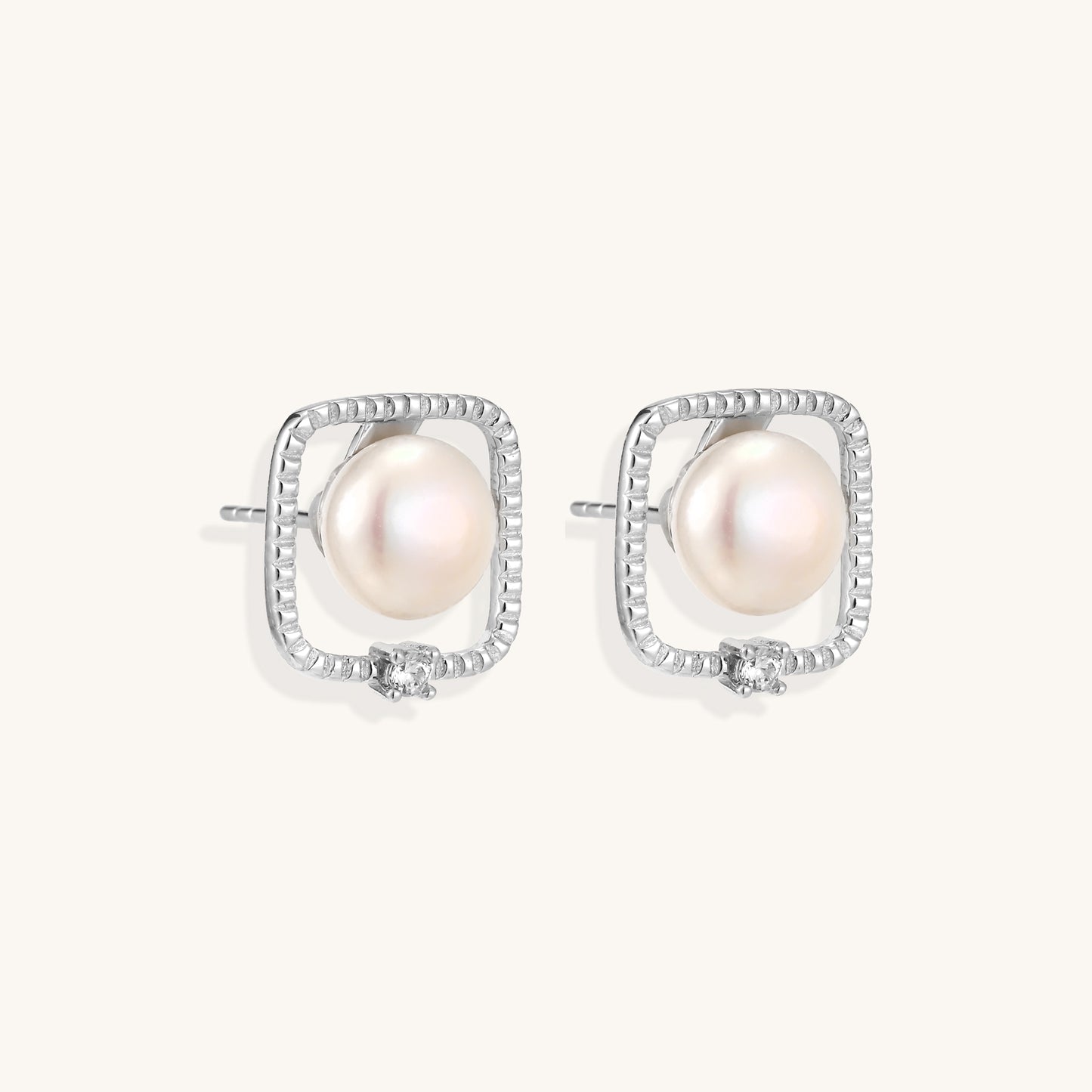 Square sterling silver stud earrings with freshwater pearls and crystal accents on white background.