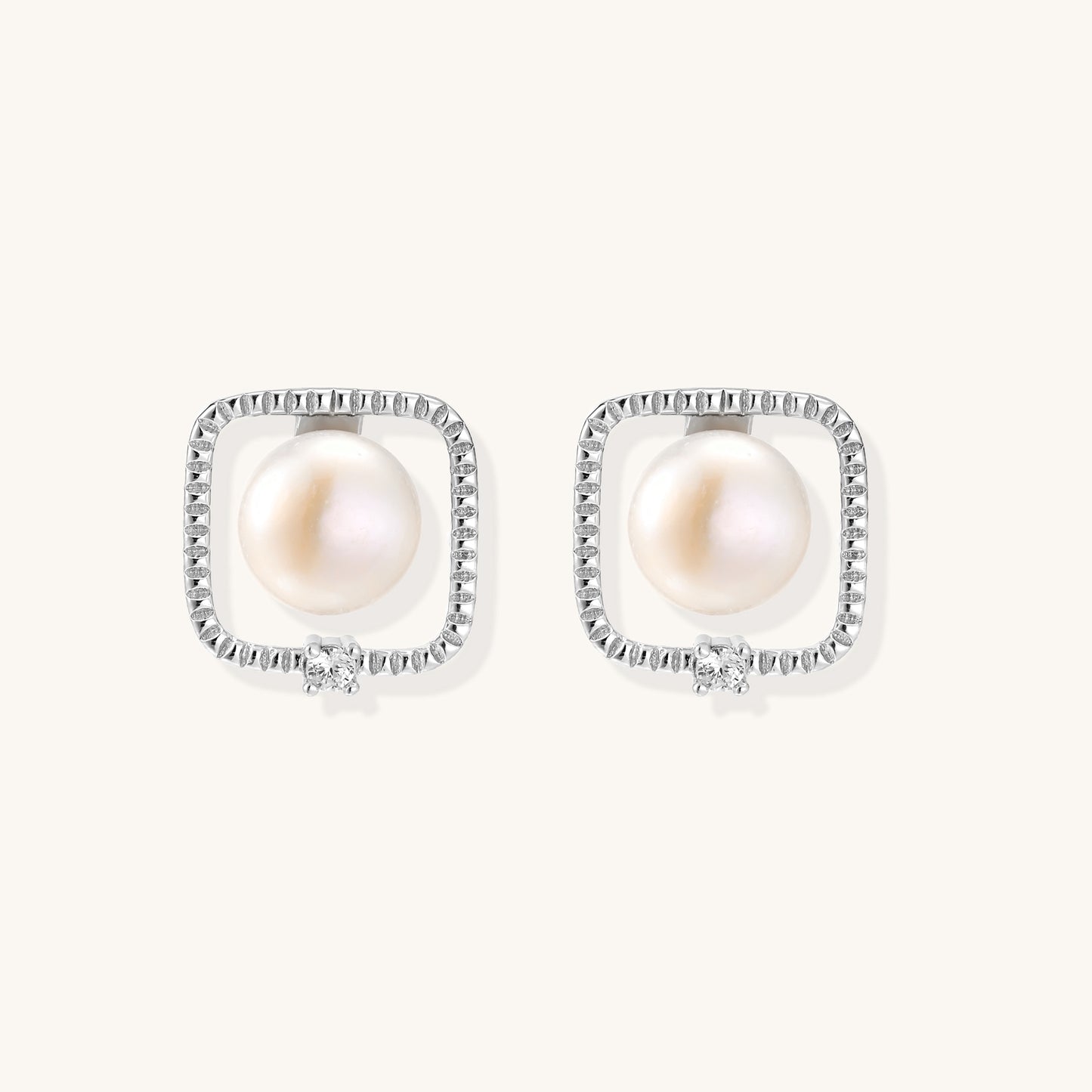 Square sterling silver stud earrings with freshwater pearls and crystal accents on white background.