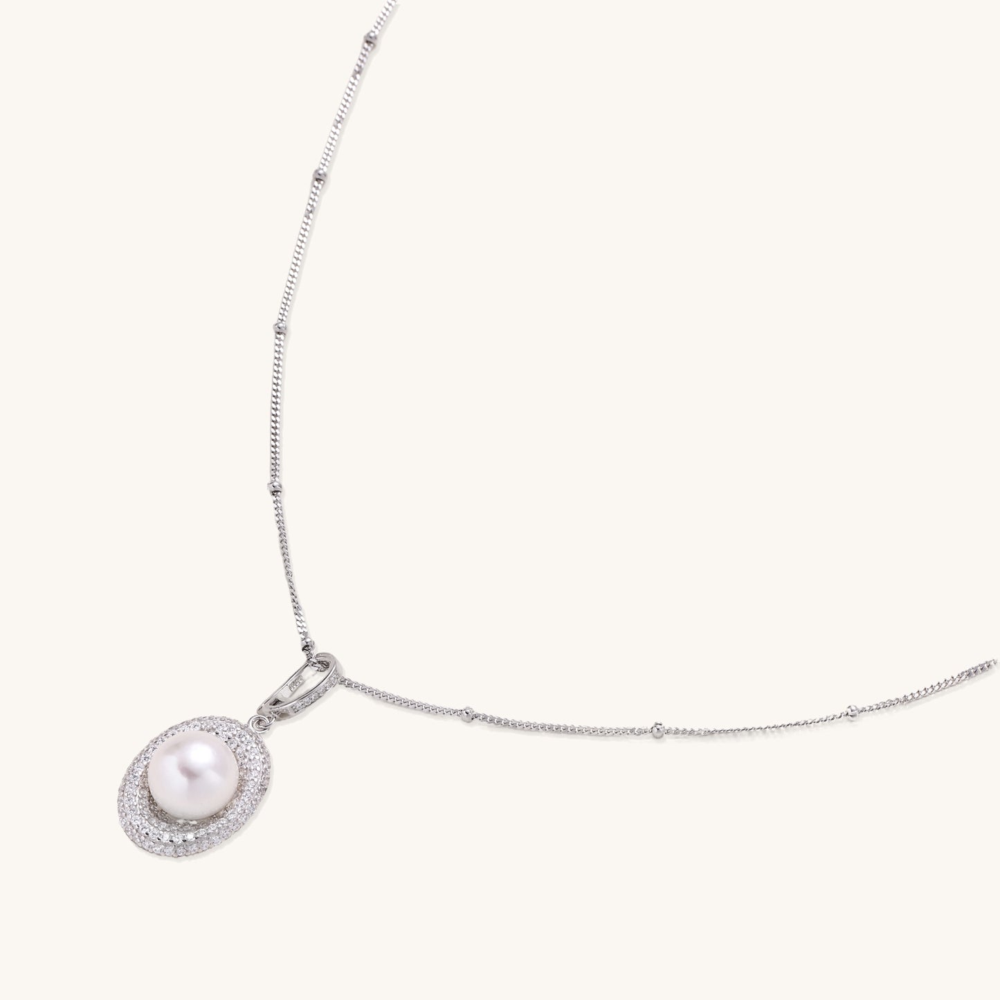 Sterling silver necklace with freshwater pearl in sparkling crystal halo pendant on delicate beaded chain