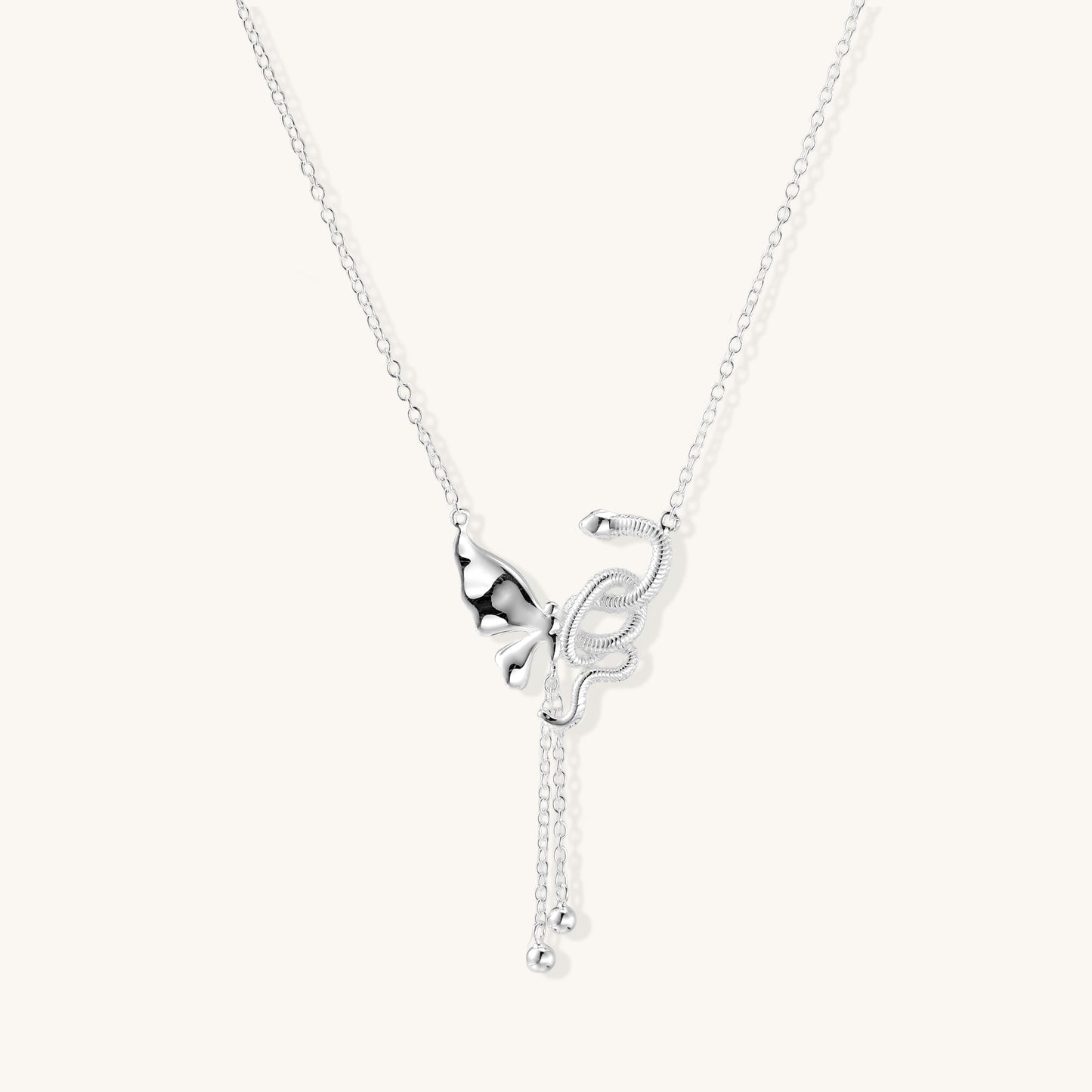 Delicate sterling silver butterfly pendant necklace with textured wing details and adjustable chain on white background
