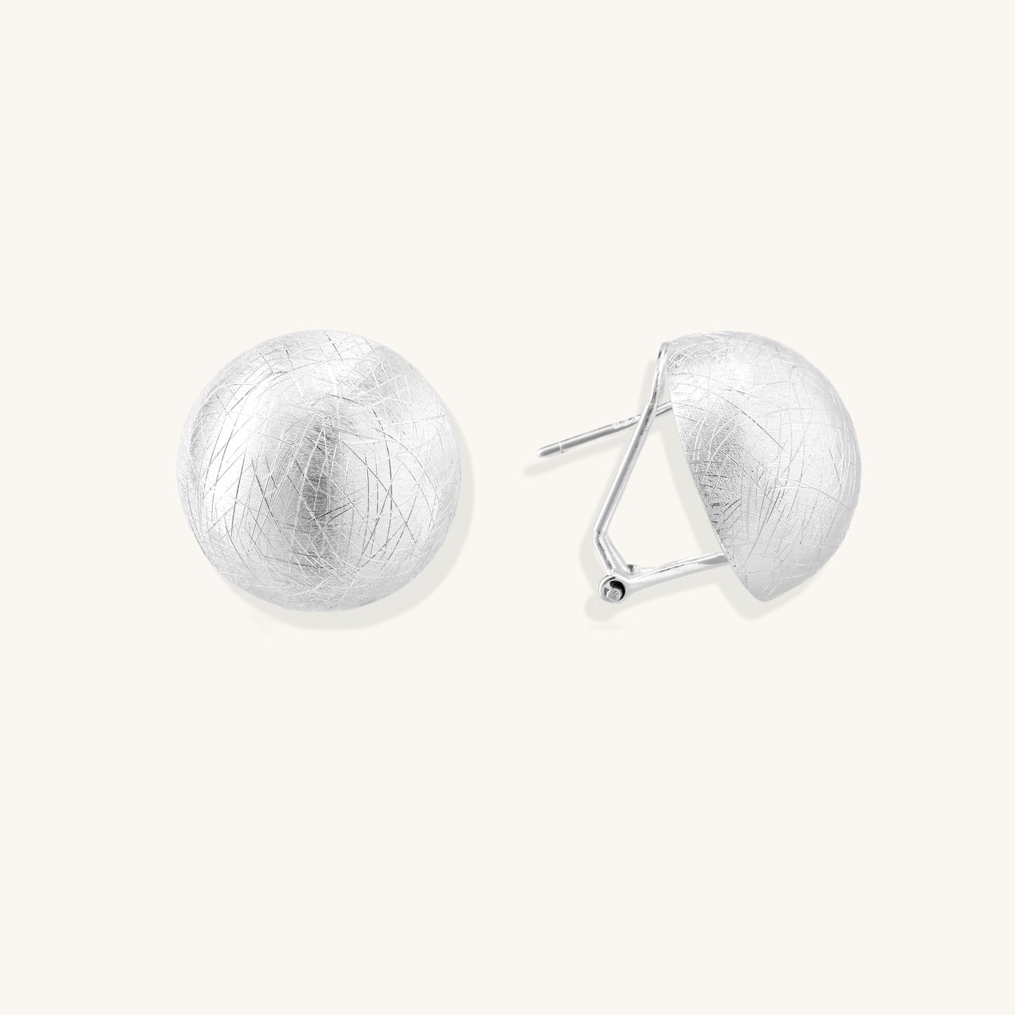 Brushed sterling silver dome-shaped stud earrings with textured surface and secure lever-back closure on white background.
