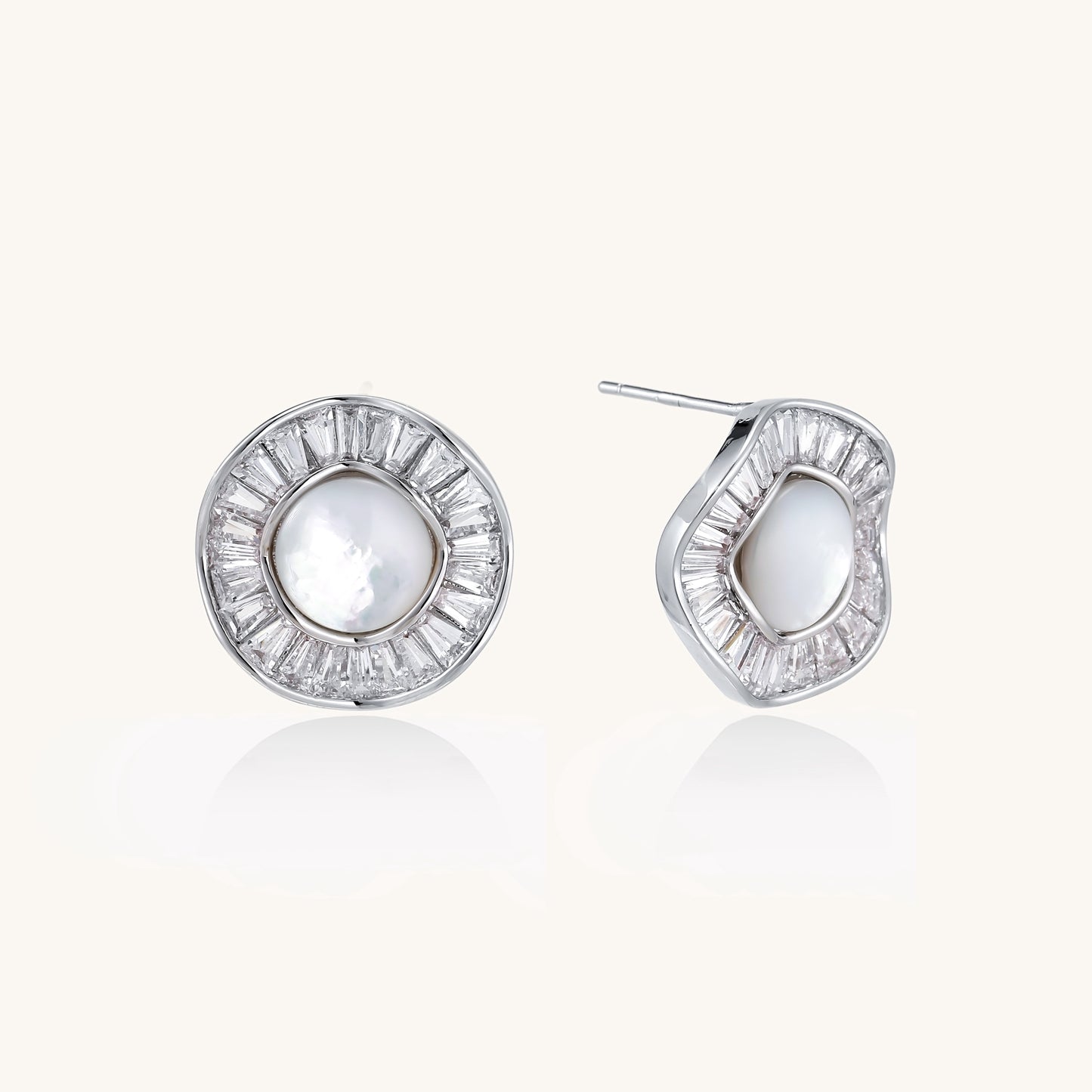 Gold-plated stud earrings with central freshwater pearl surrounded by baguette crystals in radial pattern