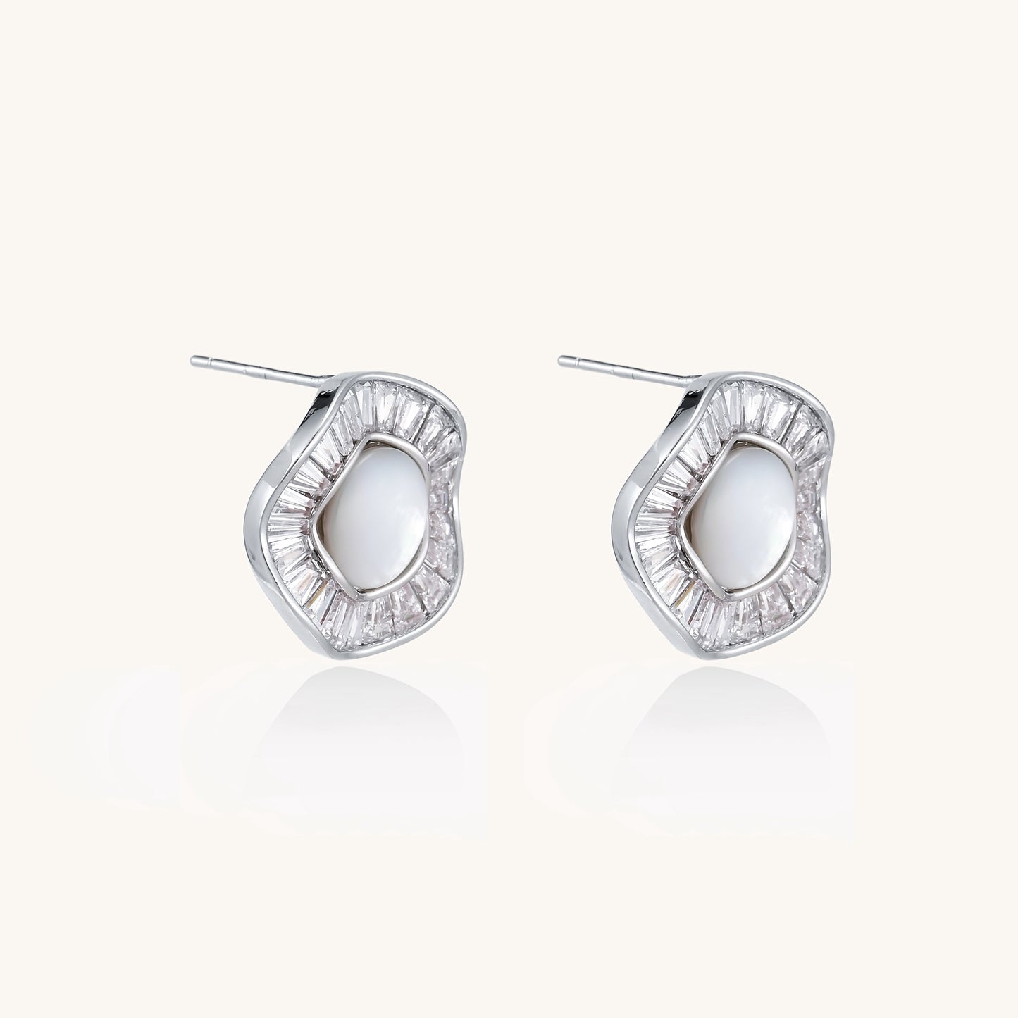 Gold-plated stud earrings with central freshwater pearl surrounded by baguette crystals in radial pattern