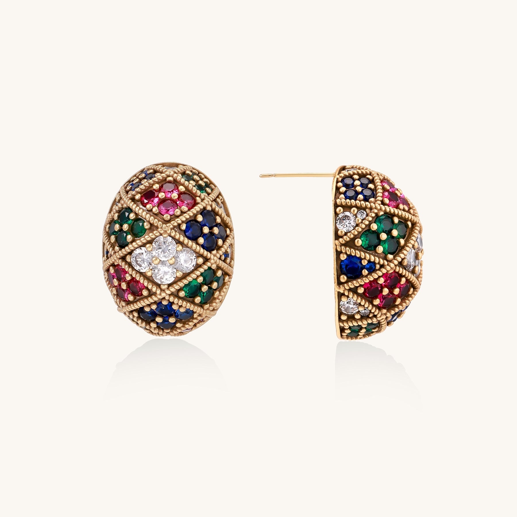 Oval gold-plated stud earrings with multicolor zirconia stones in geometric diamond pattern on white background.