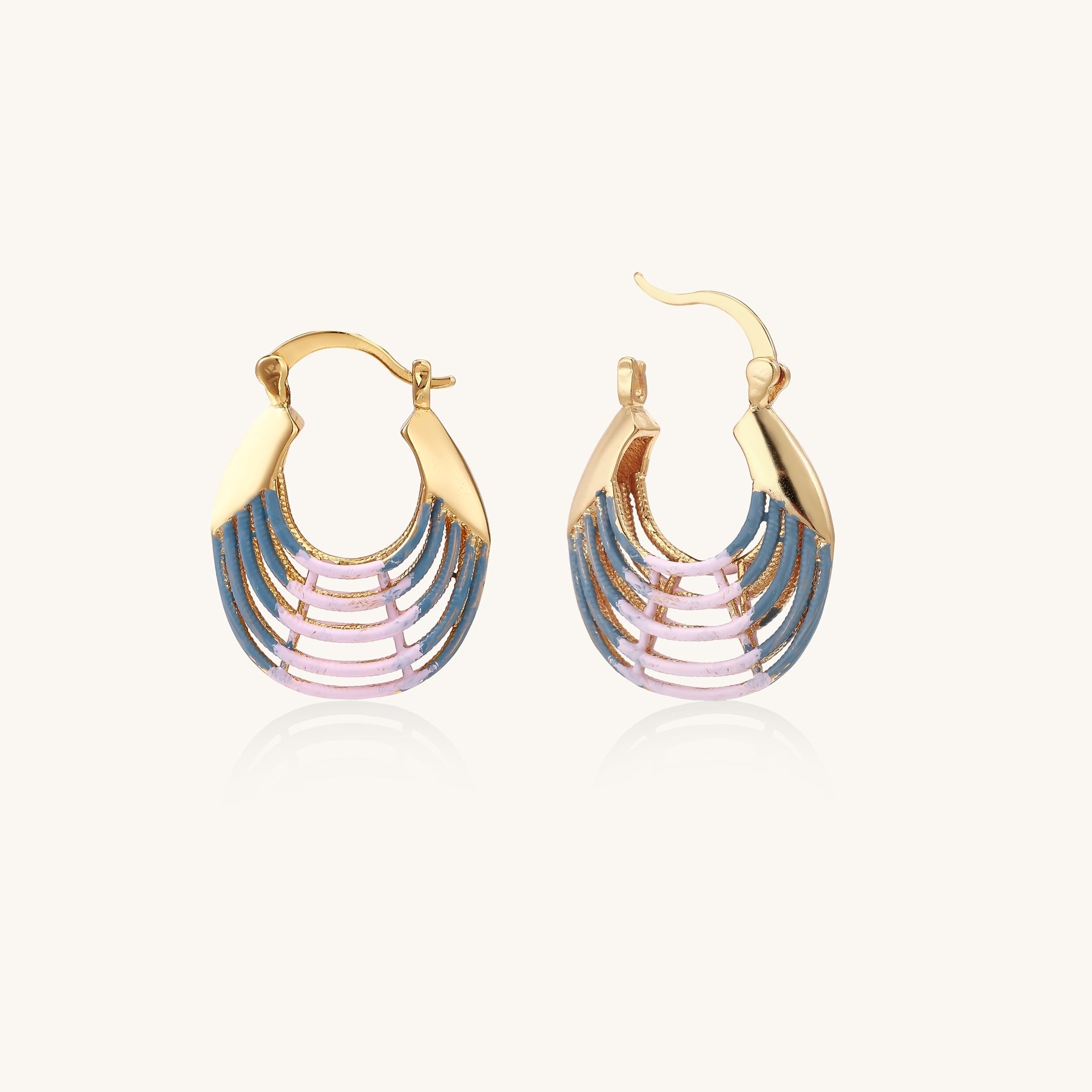 Gold hoop earrings with layered blue to pink enamel in shell pattern, photographed against white background