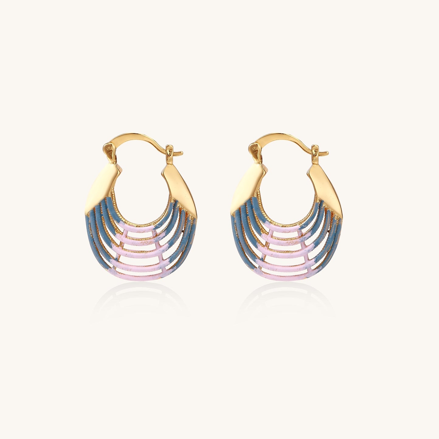 Gold hoop earrings with layered blue to pink enamel in shell pattern, photographed against white background