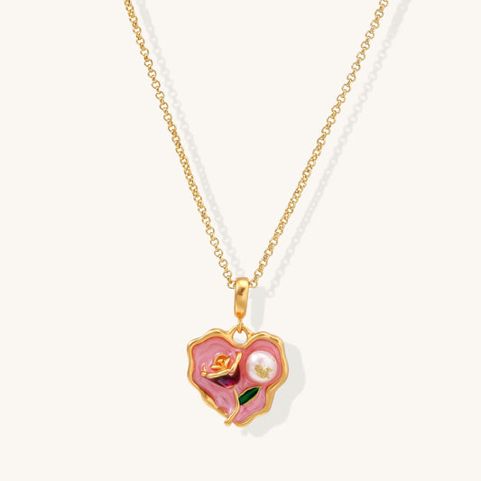 Gold-plated heart pendant necklace with pink enamel rose design and freshwater pearl on adjustable chain