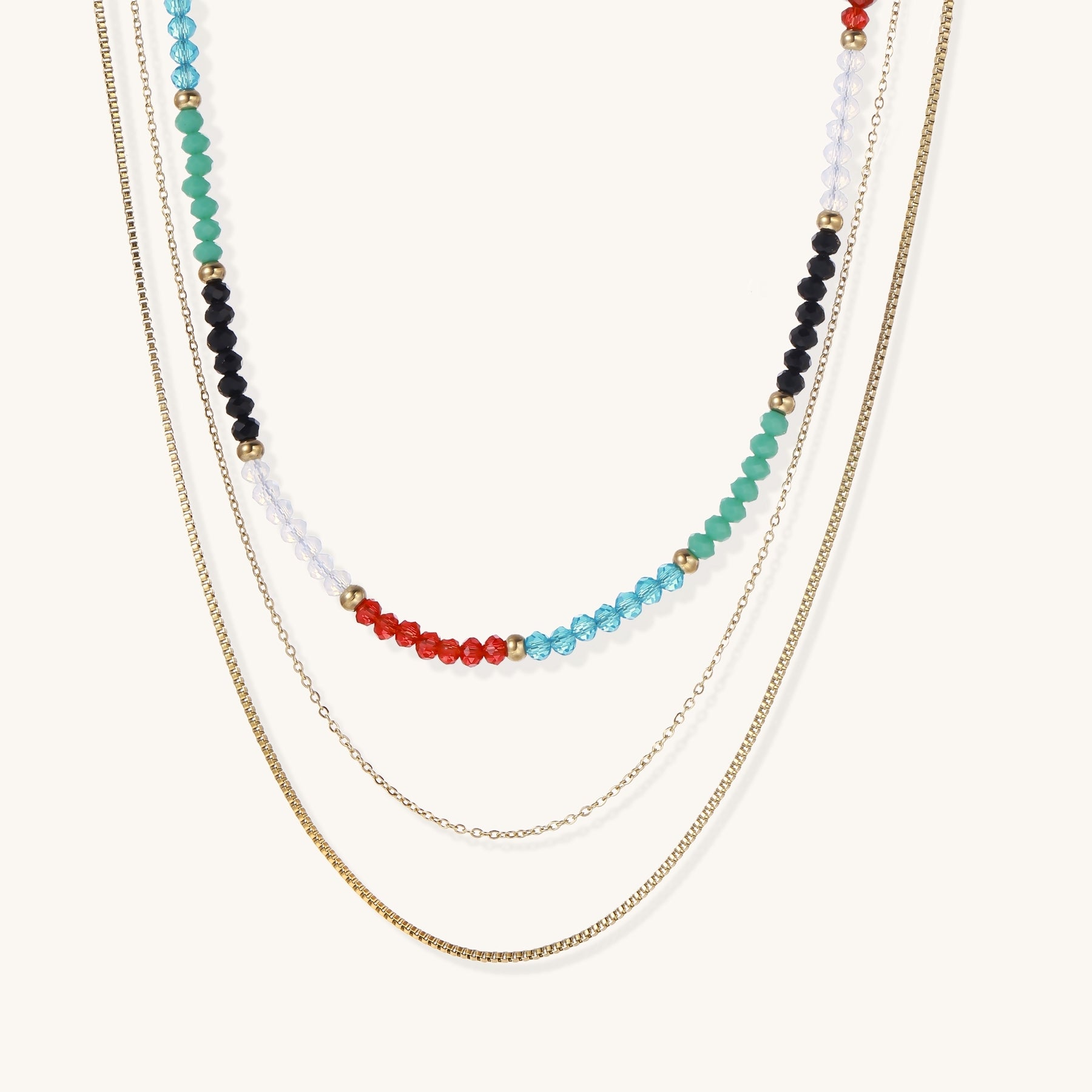 Layered gold-plated necklace set featuring colorful crystal beads in turquoise, green, black, red, and clear tones