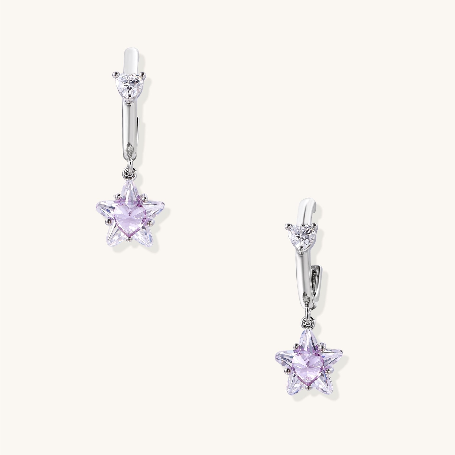 Drop earrings with purple star-shaped zirconia stones and clear teardrop accents in gold-plated brass setting