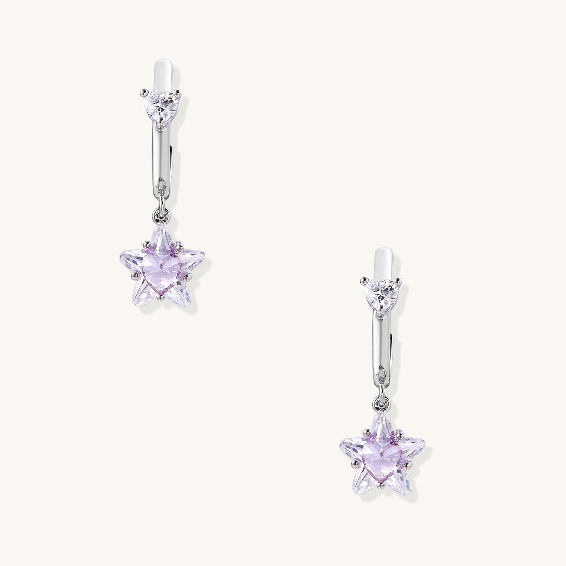 Drop earrings with purple star-shaped zirconia stones and clear teardrop accents in gold-plated brass setting