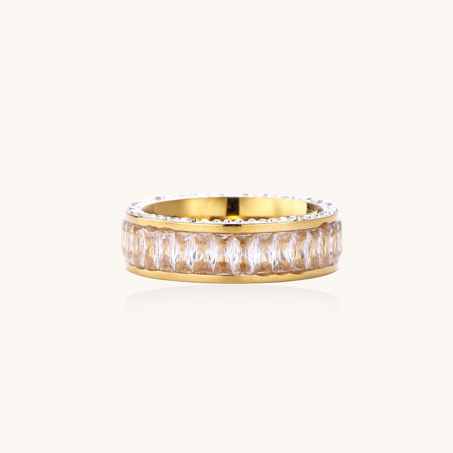 Close-up of a gold-plated eternity ring featuring two parallel rows of brilliant zirconia stones on white background.