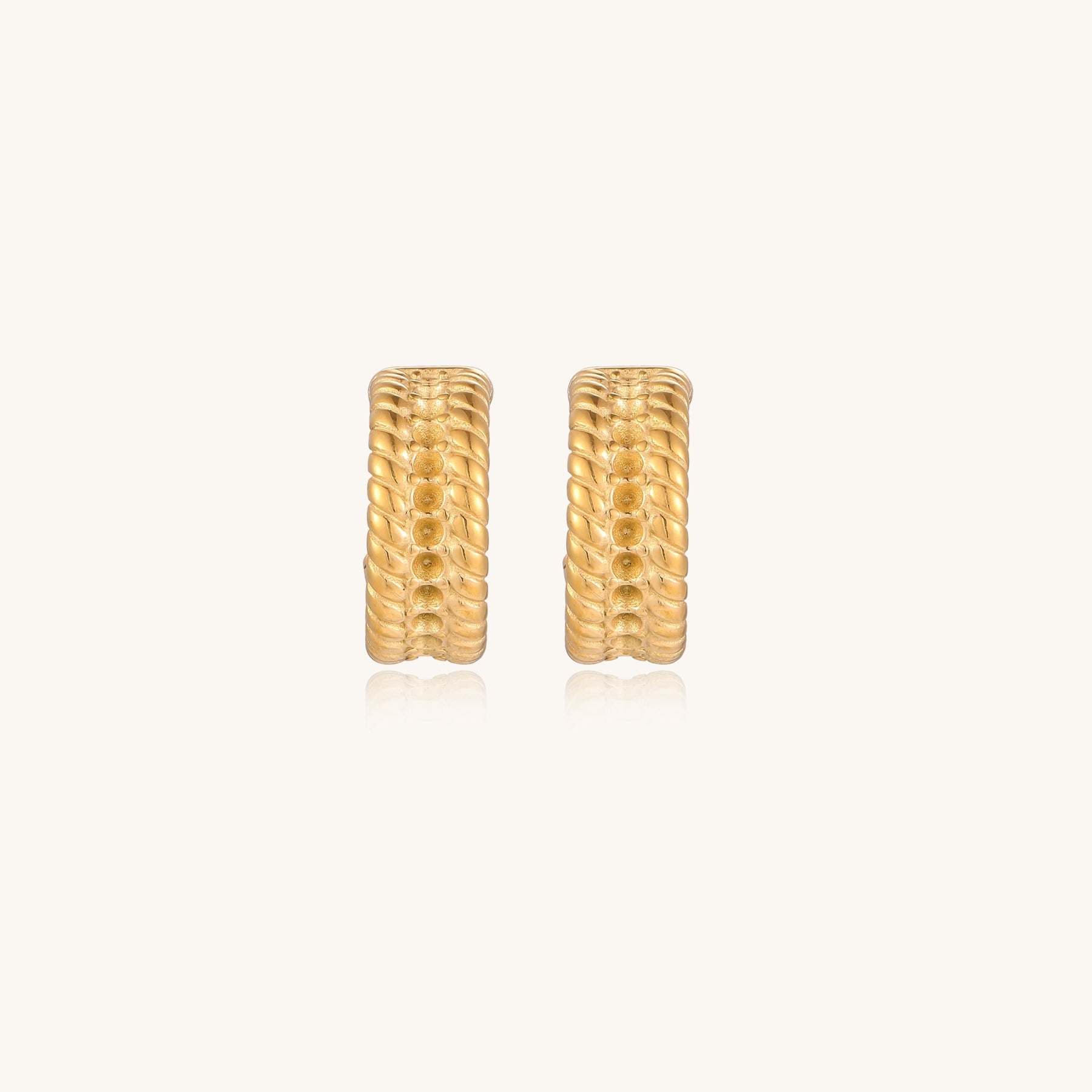 Close-up of 14K gold plated textured hoop earrings with rope pattern against cream background showing convertible design